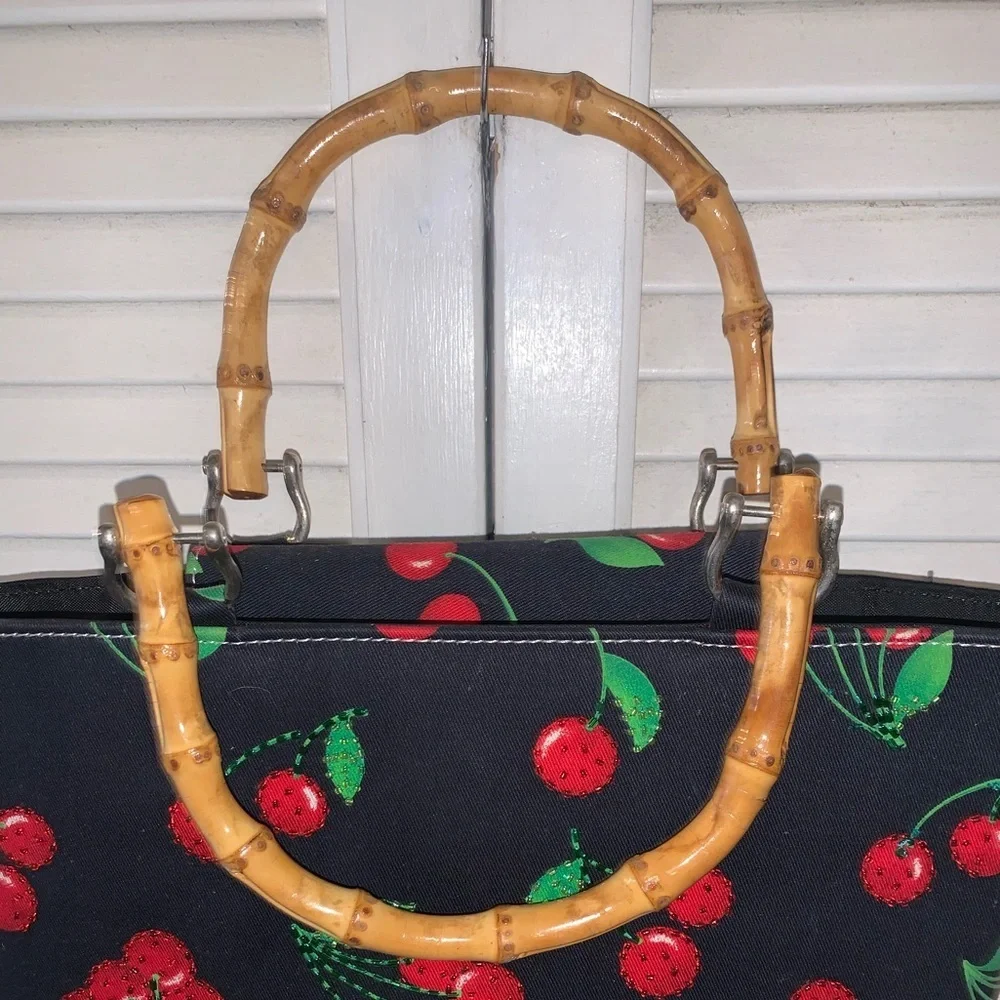 Black purse with red cherries and bamboo handles large
